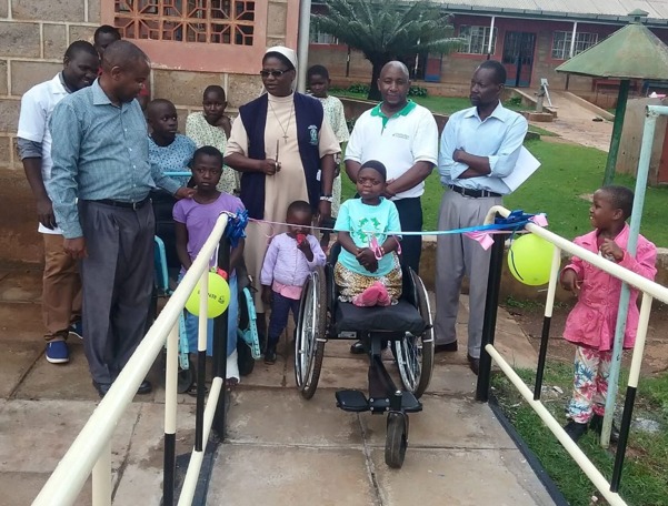 A dedicated therapist guides a patient through rehabilitation exercises at Nyabondo Centre