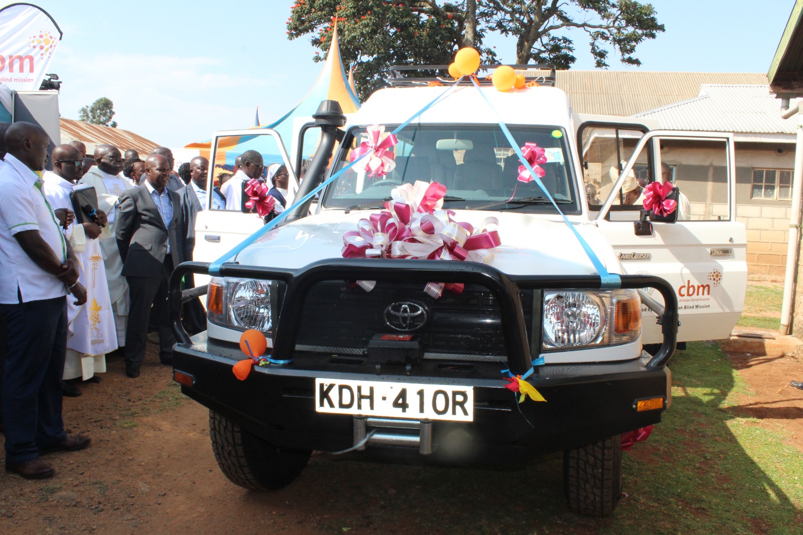 Community members taking a look at the new car