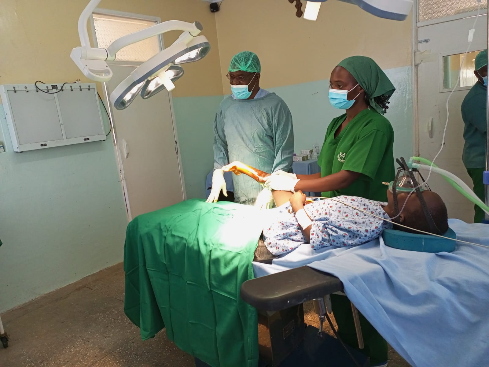 Surgeons performing a corrective orthopaedic procedure at Nyabondo