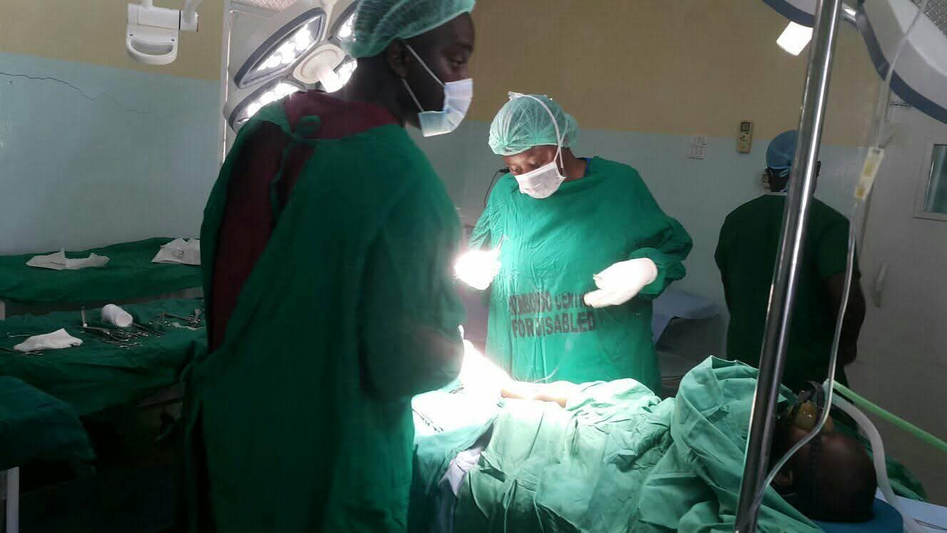 Surgeons performing a corrective orthopaedic procedure