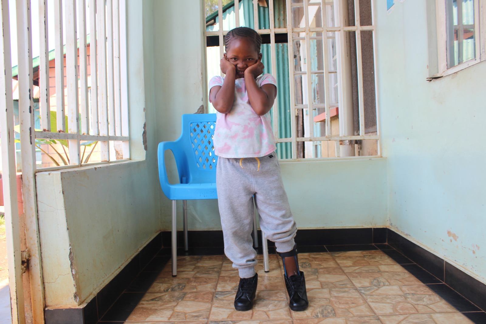 A young girl smiling after corrective surgery at Nyabondo